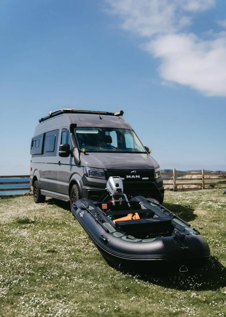 Camper Van with Hydrus Boat in front