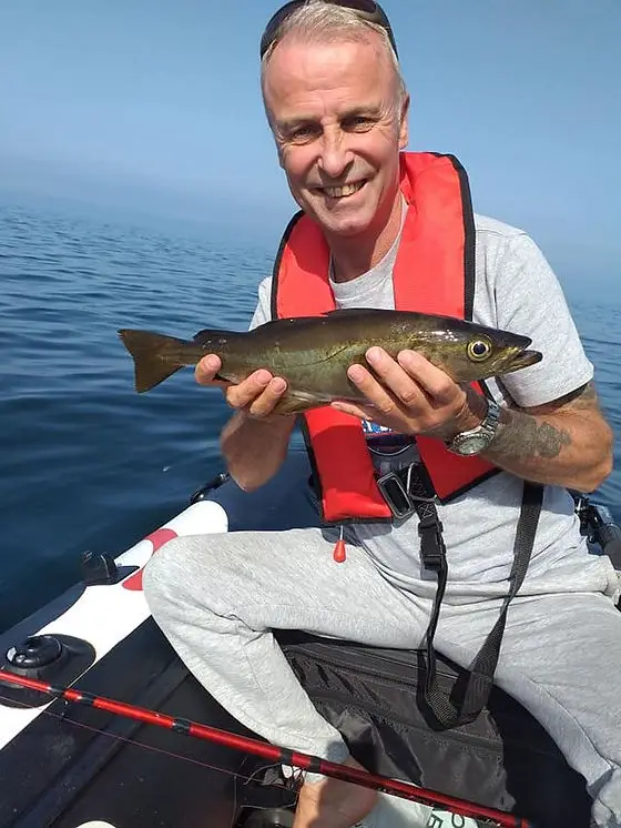Man in Hydrus Holding a fish
