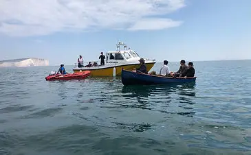 inflatable boat fishing assisting filming of vindication swim