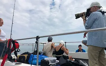 inflatable boat fishing assisting filming of vindication swim