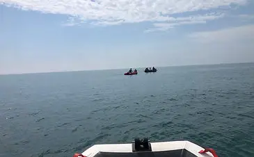 inflatable boat fishing assisting filming of vindication swim