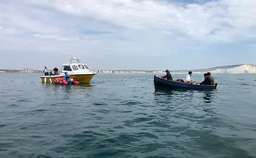 inflatable boat fishing assisting filming of vindication swim
