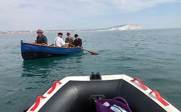 inflatable boat fishing assisting filming of vindication swim