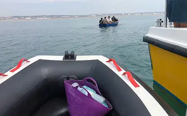 inflatable boat fishing assisting filming of vindication swim
